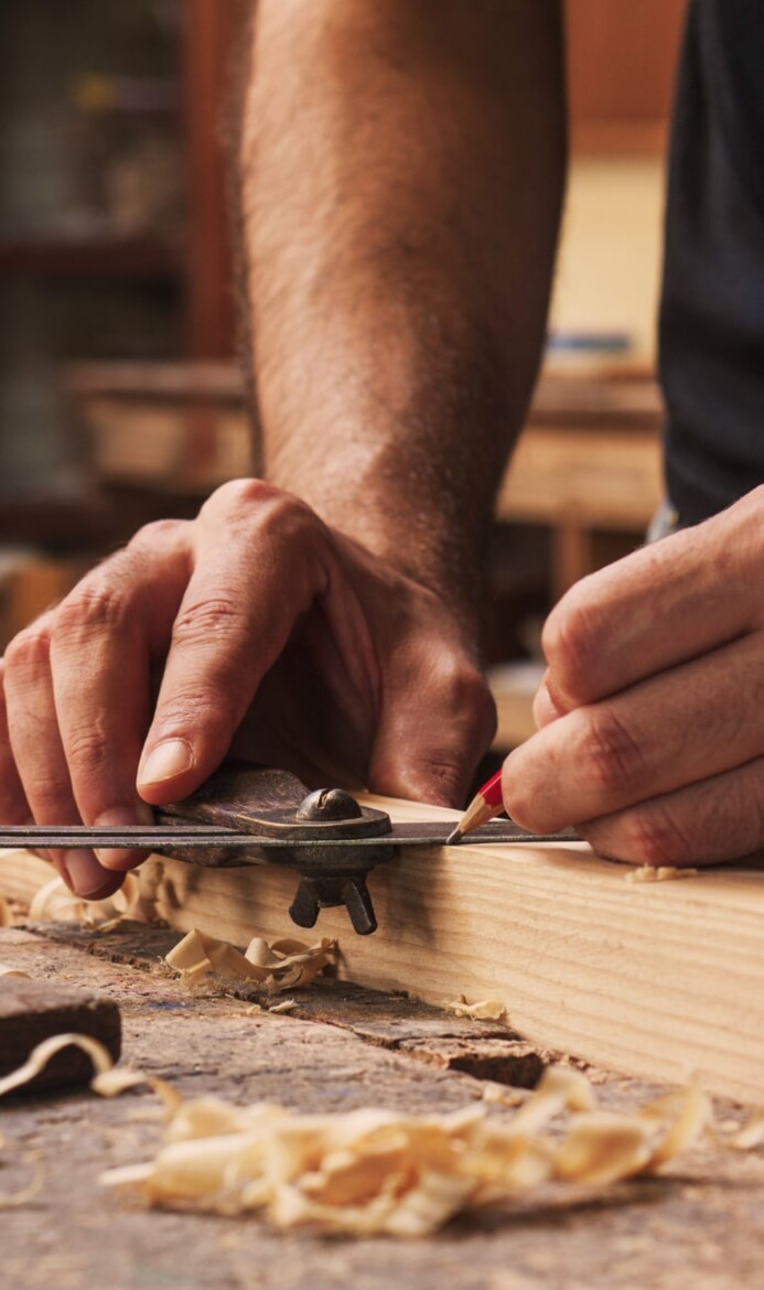 Carpenter hands and wood Green sustainable materials-min